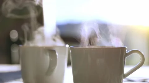 Two mugs of coffee or tea on a table in the morning for breakfast. Stock-Footage 168121026
