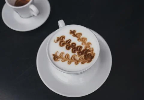 Two mugs of coffee on the table Stock Photos