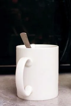 Two mugs on the kitchen table closeup Stock Photos