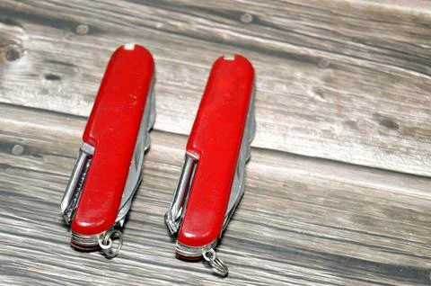 Two multi-tool pocket army knifes, a compact, folding device that combines .. Fotos de archivo