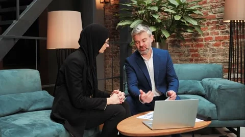 Two multicultural businessmen discuss the project, commercial offer in hotel. Stock Footage 232491604