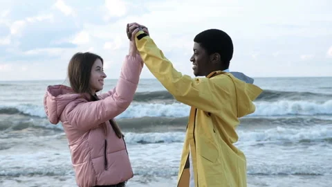 Two multicultural free person of black male and attractive european female. Love Stock Footage 199493074
