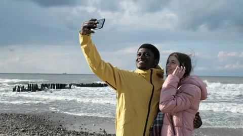 Two multicultural persons of black guy and caucasian female making a photography Stock Footage 199493030