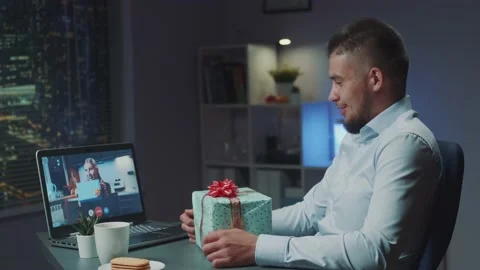 Two multiracial friends making video call to share emotions from unpacking their Stock Footage 157573967