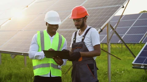 Two multiracial male engineers Currently working on plans to install solar Stock Footage 246824842