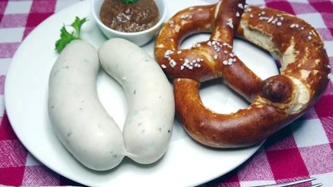 Two munich white sausages, pretzel and sweet bavarian mustard, rotating Stock Footage 236028030