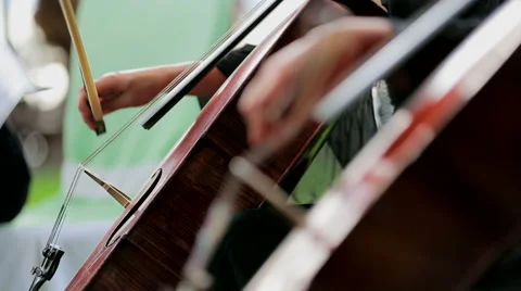 Two Musicians Playing the Violoncello. Close-up. Stock Footage 43802934