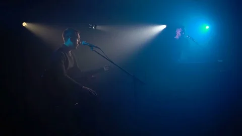 Two musicians sing into the microphone Vídeo Stock 75570558