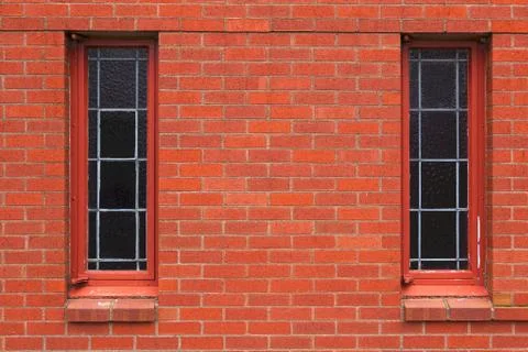 Two narrow windows in brick wall Stock Photos
