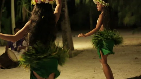 Two native Tahitian hula dancers smile, spin and perform Video stock 68101129