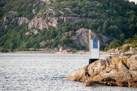 Two navigational lights on rocky cliffs Stock Photos