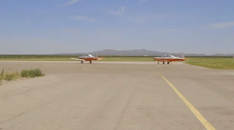 Two Navy Planes Parked on the Tarmac at the Airport Stock Footage 60847296