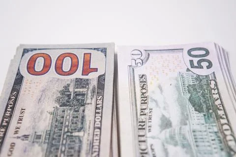 Two neat vertical stacks of United States dollar banknotes arranged side by.. Stock Photos