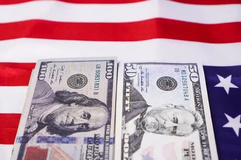 Two neat vertical stacks of United States dollar banknotes arranged side by.. Stock Photos