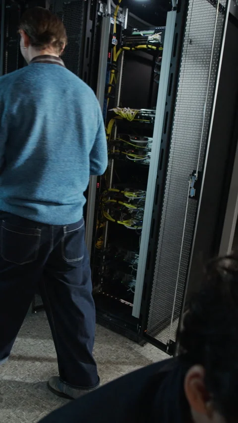 Two Network Engineers Working Together in Data Center Stock Footage 330547005