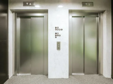 Two new elevators in the hotel. Material is stainless steel. Between the Stock Photos
