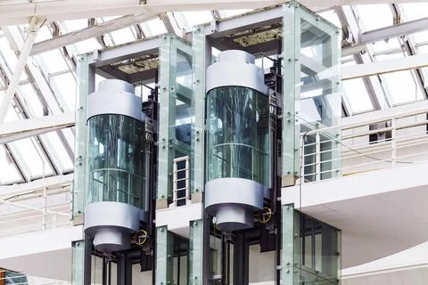 Two new glass elevators prepared for installation Stock Photos