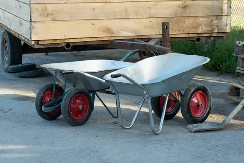 Two new hand wheelbarrows on a construction site Stock Photos