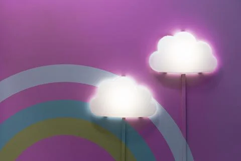 Two night lamps in the shape of a cloud on a bright wall in a children's bedroom Stock Photos