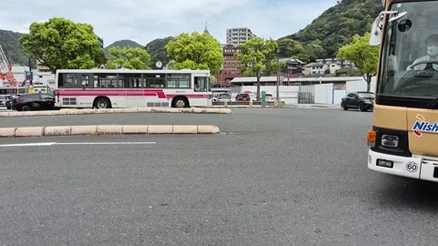 Two Nishitetsu commuter buses arriving Video stock 337282503