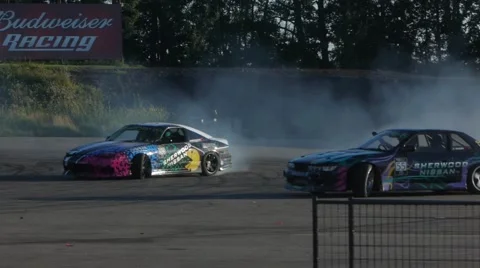 Two Nissan's drift side by side at drifting event Stock Footage 59747484