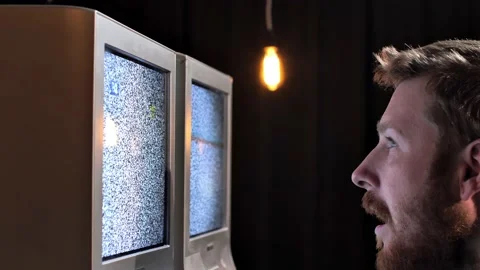 Two non-working TVs with noise on the screens Stock Footage 219635398