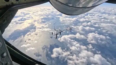 Two NORAD F-15C Eagle aircraft flying above the clouds Stock Footage 268996738