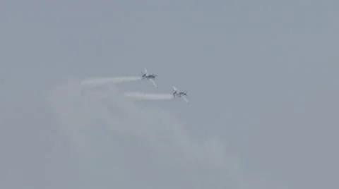 Two North American T-6 Texan warbirds performing at EAA AirVenture Oshkosh Stock Footage 50188977