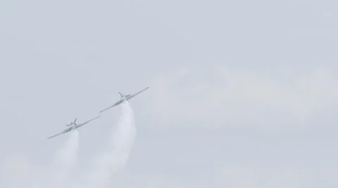 Two North American T-6 Texan warbirds performing at EAA AirVenture Oshkosh Stock Footage 50189033