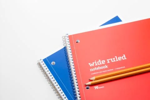 Two notebooks and two pencils on a white background. Stock Photos