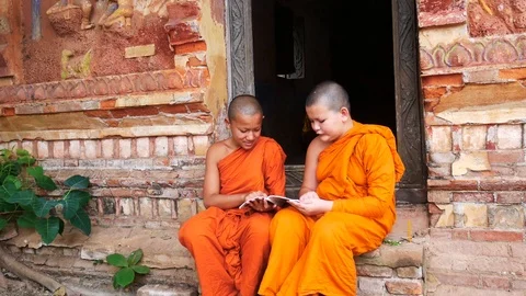 Two Novices monk reading book and education of novice Buddhist monks in Thai Video stock 89501554