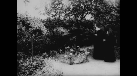 Two nuns looking at a grave Stock Footage 43314300