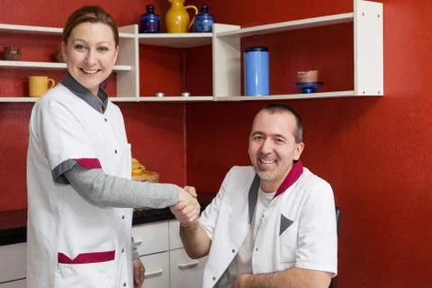 Two nurses giving each other the hand Fotos Stock