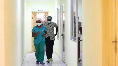 Two nurses running to attend to an emergency case Stock Footage 172001592