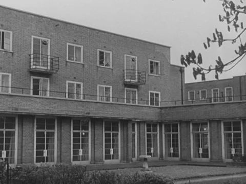 Two nurses talking together after work about their job in their room, UK 1951 Stock Footage 134029732