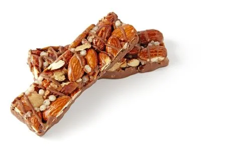 Two nutritious protein bars with nuts and caramel and chocolate isolated on.. Stock Photos