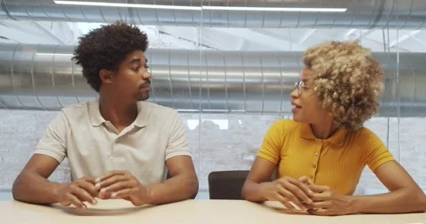 Two office afro workers shake hands approving a contract or agreement. Stock Footage 158821398