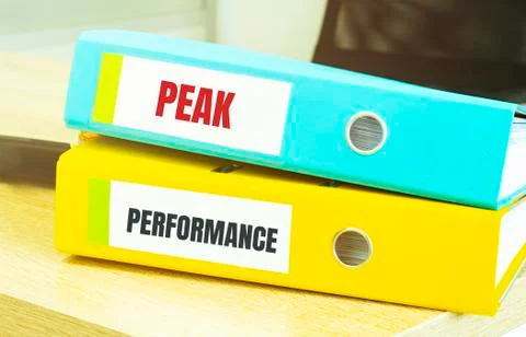 Two office folders with text peak performance Stock Photos