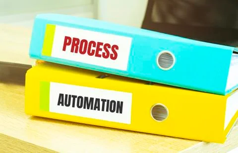 Two office folders with text PROCESS AUTOMATION Stock Photos