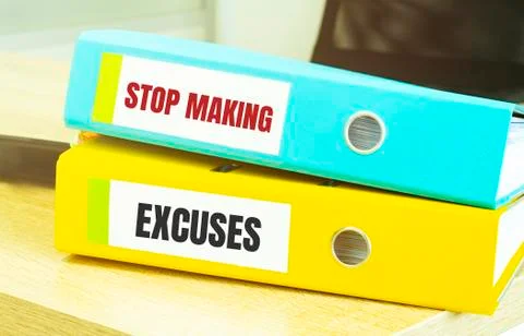 Two office folders with text STOP MAKING EXCUSES Stock Photos