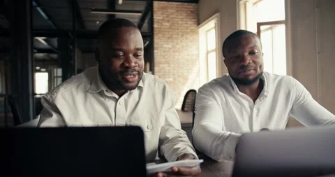 Two office workers with Black skin color and white clothing production shirts Vídeos de archivo 246417749