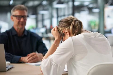 Two Office Workers Discuss Hiring Mistake During Tense Disciplinary Meeting. Stock Photos