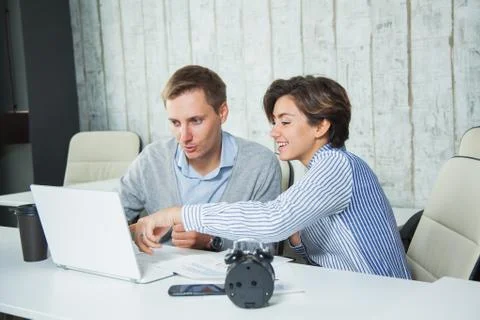 Two office workers team job lap top cooperation students 库存照片