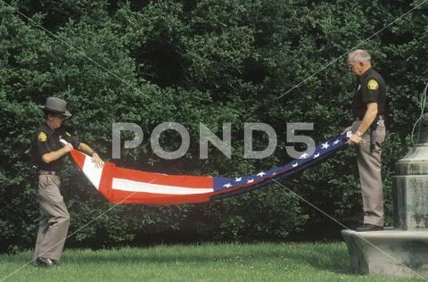 Two Officers Folding the American Flag, Charlottesville, Virginia Stock Photos