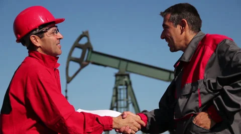 Two Oil and Gas Engineers Shaking Hands Stock Footage 32776331