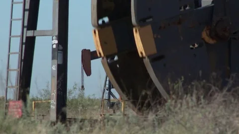 Two oil pump jacks working in tight competition, 4K. Stock Footage 80031894