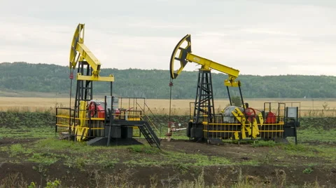 Two oil pumps at work Stock Footage 45325486