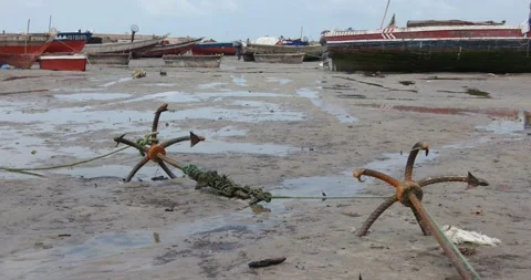 Two old anchors on the beach sand Stock Footage 159351582