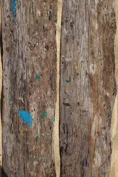 Two old boards with spots of paint on the sand Stock Photos