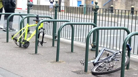 Two old broken bikes lying on the floor Stock Footage 277362651